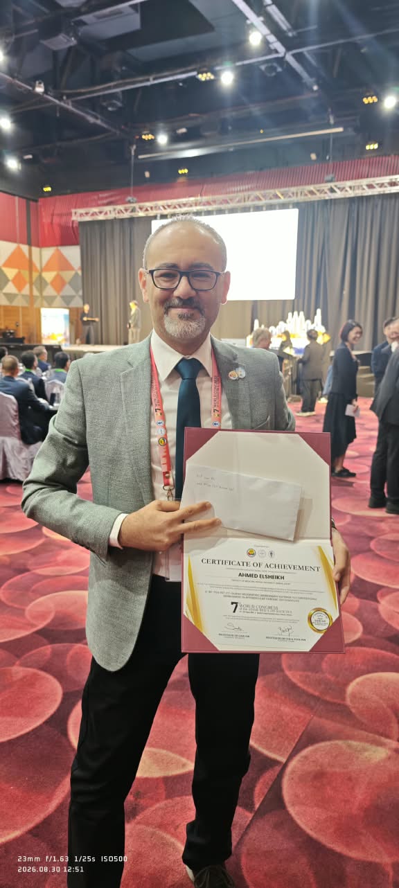 Prof. Ahmed Elsheikh holding the Prof Saw Aik Best Translational Paper Award certificate